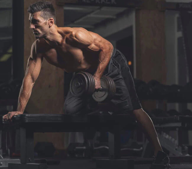 man in fitness apparel doing bent over row